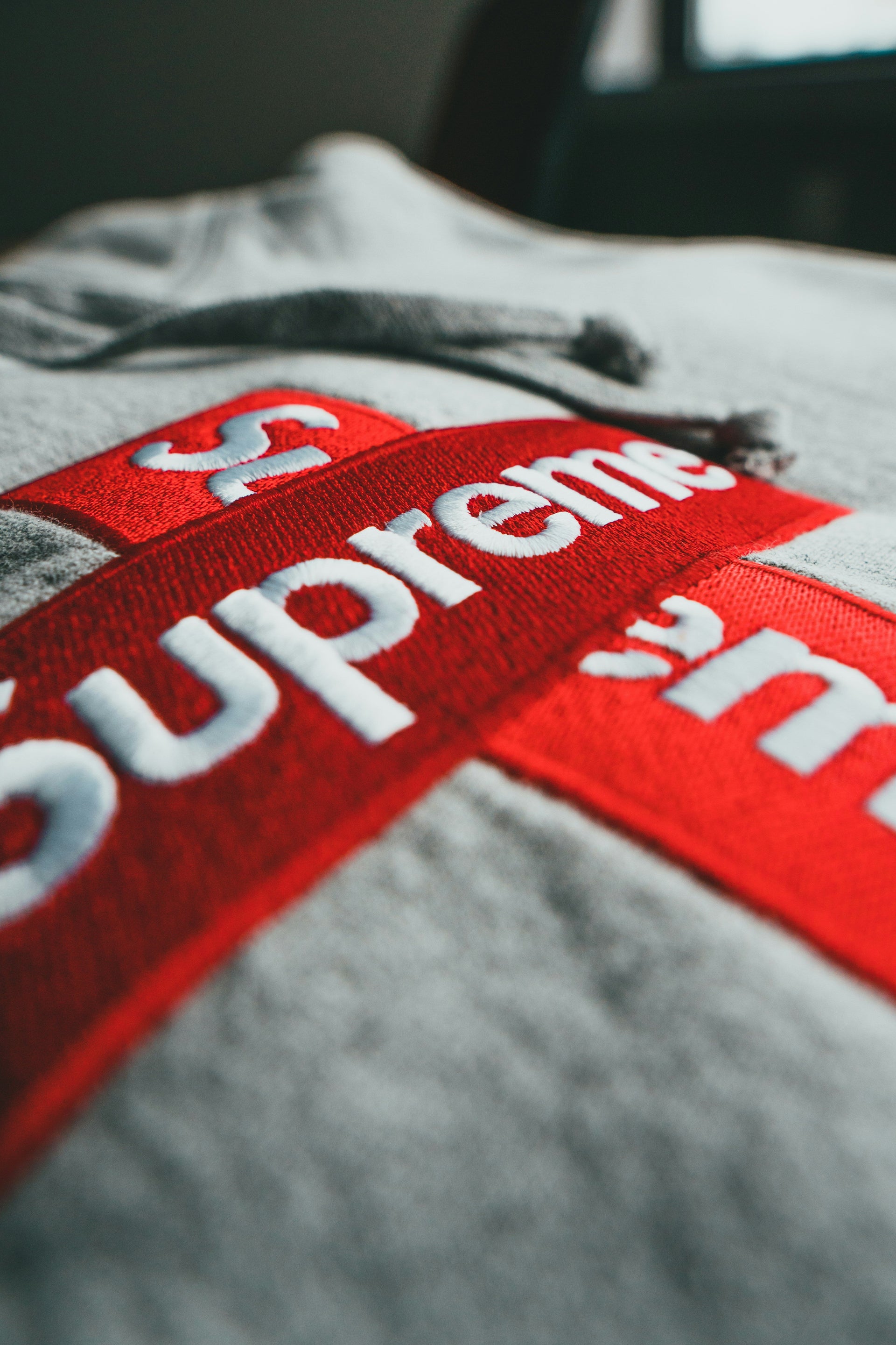 Premium outerwear collection showcasing luxury jackets and coats from leading fashion brands, including Moncler, The North Face, Supreme, Off-White, Carhartt WIP, and Balenciaga.