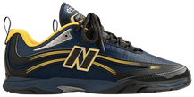 Aimé Leon Dore x New Balance RC56 'Navy' sneaker with navy mesh, yellow accents, black patent toe, and ALD floral heel crest.