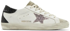 Golden Goose women's Superstar sneaker in cream suede with mauve pink glitter star and distressed rubber sole.