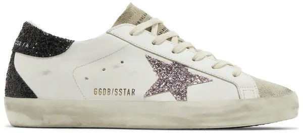 Golden Goose women's Superstar sneaker in cream suede with mauve pink glitter star and distressed rubber sole.