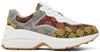 Gucci Women's Rhyton sneaker in multicolor GG monogram canvas with chunky off-white sole and bold patchwork design.


