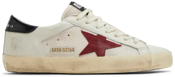 Golden Goose Superstar white leather sneaker with pomegranate red accents and black detailing.