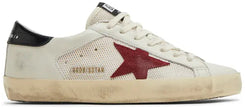 Golden Goose Superstar white leather sneaker with pomegranate red accents and black detailing.
