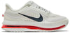 Nike Pegasus Premium 'Summit White Bright Crimson' 2025 running shoe with white mesh upper, black Swoosh, ZoomX midsole, and red Zoom Air cushioning.

