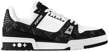 Louis Vuitton Wmns Trainer 'Black Monogram Denim' 2023 sneaker with tonal black Monogram denim upper, black leather overlays, and embossed LV branding.

