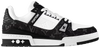 Louis Vuitton Wmns Trainer 'Black Monogram Denim' 2023 sneaker with tonal black Monogram denim upper, black leather overlays, and embossed LV branding.

