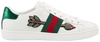 Gucci Wmns Ace Embroidered 'Arrow' in white leather with beaded arrow detail, Web stripe, and red and green metallic snakeskin heel tabs.