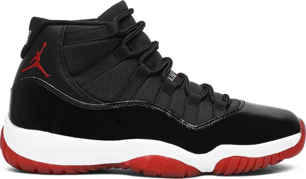 Air Jordan 11 Retro 'Bred' 2019 with black mesh upper, high-cut patent leather, white midsole, and Varsity Red translucent outsole.