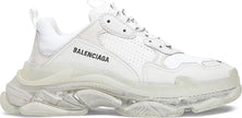 Side view of the Balenciaga Wmns Triple S showcasing the clear layered sole and distressed design.