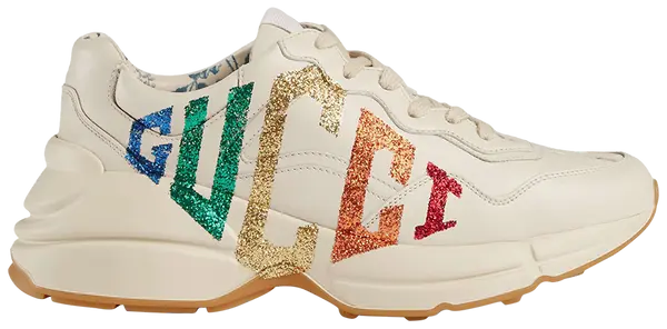 Gucci Wmns Rhyton sneaker in Mystic White leather with glitter Gucci logo and chunky sole.

