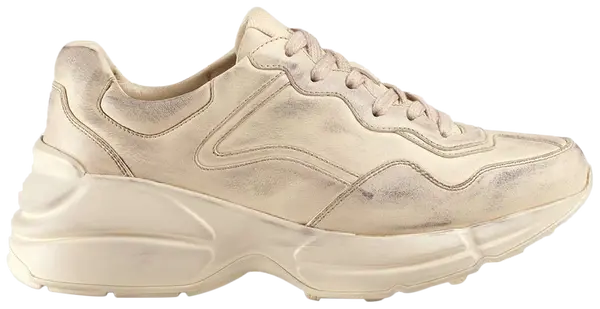 Gucci Wmns Rhyton 'Distressed Ivory' sneaker in aged cream leather with chunky sole and vintage finish.

