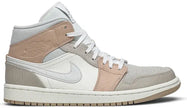 Air Jordan 1 Mid 'Milan' sneaker featuring beige suede and leather upper with MLN hangtag and Air cushioning.