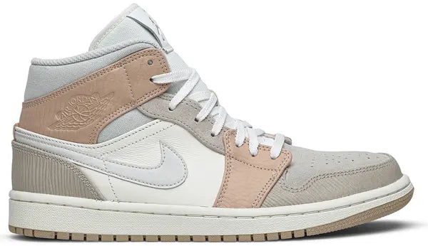 Air Jordan 1 Mid 'Milan' sneaker featuring beige suede and leather upper with MLN hangtag and Air cushioning.