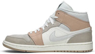 Air Jordan 1 Mid 'Milan' sneaker featuring beige suede and leather upper with MLN hangtag and Air cushioning.