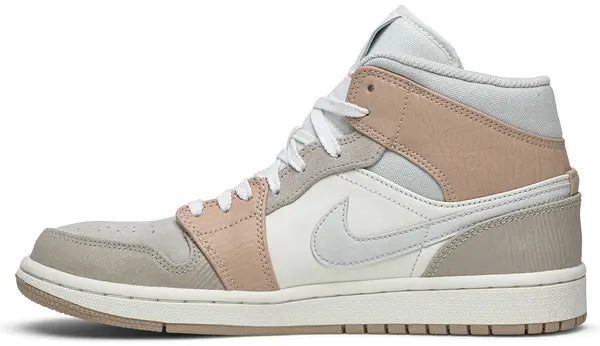 Air Jordan 1 Mid 'Milan' sneaker featuring beige suede and leather upper with MLN hangtag and Air cushioning.