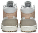 Air Jordan 1 Mid 'Milan' sneaker featuring beige suede and leather upper with MLN hangtag and Air cushioning.