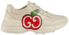 aGucci Wmns Rhyton sneaker in ivory leather featuring red GG Apple motif and thick rubber sole.

