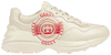 Gucci Wmns Rhyton 'Gucci Disk Print - Ivory' in cream leather with red vintage disk graphic.

