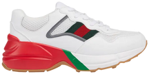 Gucci Women's Rhyton sneaker in white mesh with red and green webbing and reflective detailing on a thick off-white sole.

