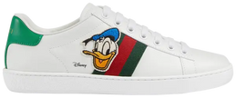 Disney x Gucci Wmns Ace sneaker in white leather with embroidered Donald Duck patch and green-red Gucci Web detailing.


