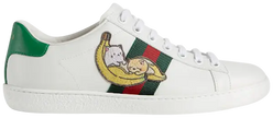 Gucci Wmns Ace 'Bananya' sneaker in white leather with green heel tab and Bananya anime character graphic.
