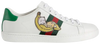 Gucci Wmns Ace 'Bananya' sneaker in white leather with green heel tab and Bananya anime character graphic.

