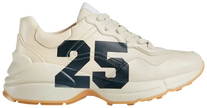 Gucci women’s Rhyton ‘25 - Ivory’ sneaker in sustainable Demetra leather with chunky cream sole and minimalist branding.

