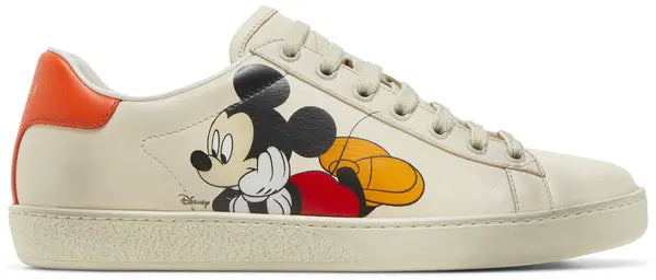 Disney x Gucci Wmns Ace Low 'Mickey Mouse - Ivory' sneaker featuring Mickey Mouse print on ivory leather with orange heel tab.