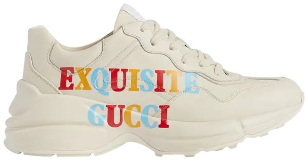Gucci Wmns Rhyton 'Exquisite Gucci - Ivory' sneaker with bold text graphic on ivory leather and oversized sole.

