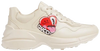 Discover the Hattie Stewart x Gucci Wmns Rhyton 'Serigraphy Heart' sneaker featuring ivory leather, bold serigraphy heart graphics, and Gucci’s iconic chunky sole.

