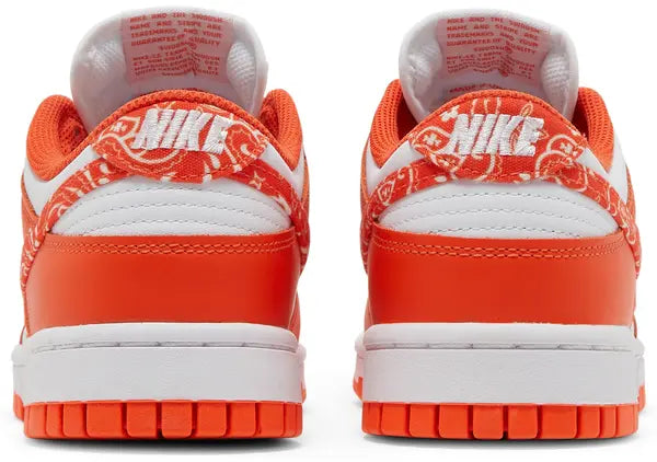 Nike Dunk Low Women’s 'Orange Paisley' sneaker with white leather upper, orange overlays, and paisley print Swoosh.