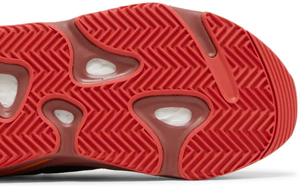 Yeezy Boost 700 ‘Hi-Res Red’ sneaker with red mesh and suede upper, maroon Boost midsole, and multicolor accents.