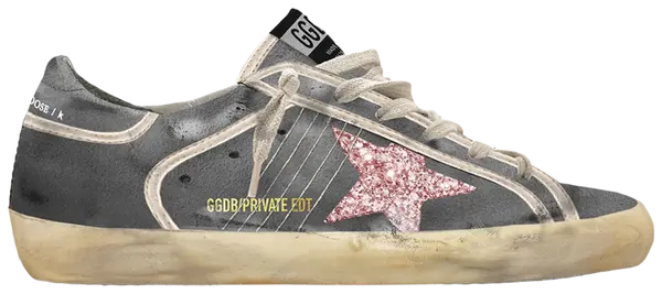 Golden Goose Superstar grey suede sneaker with bubblegum pink glitter star patch on the side.