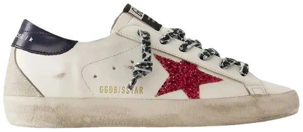 Golden Goose women's Superstar sneaker in white leather with blue glitter star, pink heel tab, and distressed vintage sole.
