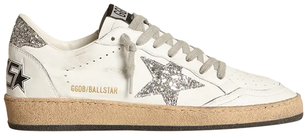 Golden Goose Ball Star women’s sneaker in white leather with silver glitter star and metallic heel, featuring vintage-style distressed sole.

