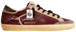 Golden Goose Superstar Penstar LAB women's sneaker in burgundy suede with Swarovski crystal star and distressed sole.

