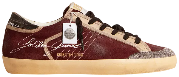 Golden Goose Superstar Penstar LAB women's sneaker in burgundy suede with Swarovski crystal star and distressed sole.

