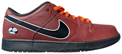 Limosine x Nike Dunk Low SB 'Football' sneaker with orange basketball leather upper, black glossy Swoosh, white trim, and Zoom Air sole for skateboarding.

