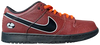 Limosine x Nike Dunk Low SB 'Football' sneaker with orange basketball leather upper, black glossy Swoosh, white trim, and Zoom Air sole for skateboarding.

